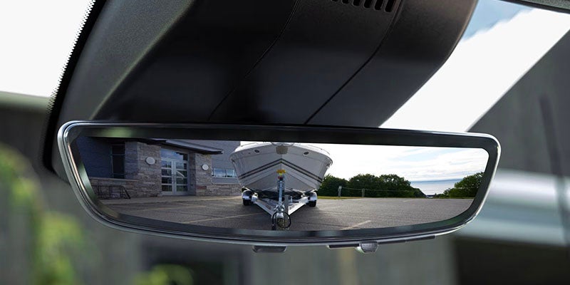 Boat and trailer framed in the 2026 Silverado 2500HD camera rear-view mirror
